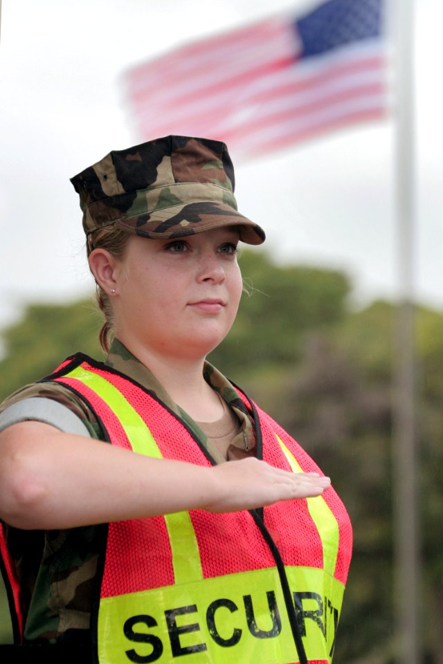 US Navy 040329-N-3228G-020 Master-at-Arms 3rd Class Mindy Rousseau, assigned to Naval Station (NAVSTA) Pearl Harbor Security, checks identification cards and inspect vehicles requesting access to NAVSTA Pearl Harbor