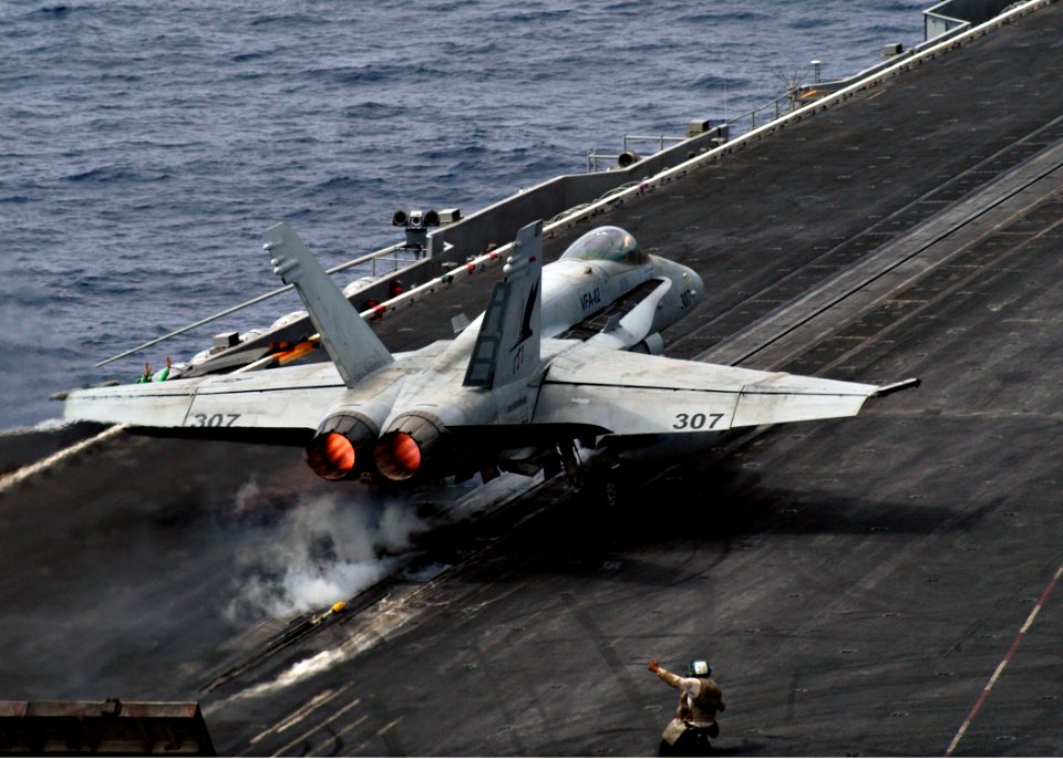 US Navy 040714-N-7263H-001 An F-A 18 Hornet assigned to the Mauraders of Fighter Attack Squadron Eight Two (VFA 82) takes off from the flight deck aboard USS Enterprise (CNV 65)