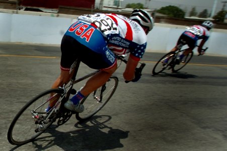 US Navy 040616-N-2653P-399 Navy cyclist Aerographer's Mate 1st Class Shawn Olin, assigned to U.S. Naval European Meteorology and Oceanography Facility (NEMOF), Naples, Italy, takes a turn near I-10 in downtown Redland, Calif.,