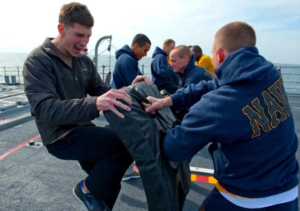 US Navy 120125-N-VY256-101 A Sailor executes a knee strike during an armed sentry security reaction force course