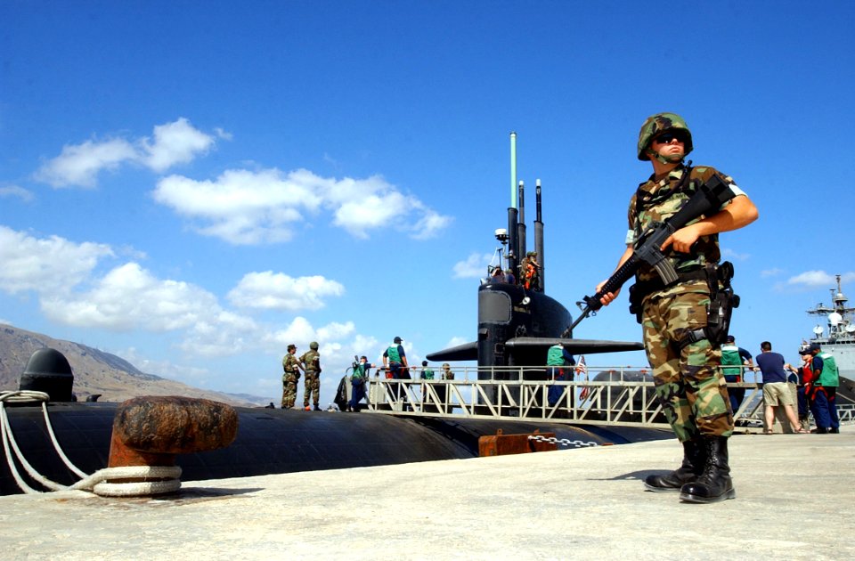 US Navy 040719-N-0780F-012 Master-at-Arms Seaman Apprentice Nathan Hastings, from Henry, Ill., scans the surrounding area while standing a pier security watch as the Los Angeles-class attack submarine USS Dallas (SSN 700) prepa