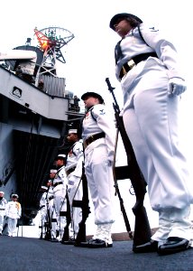 US Navy 040620-N-9446C-051 Ceremonial Guard Members assigned to the Nimitz-class aircraft carrier USS Carl Vinson (CVN 70) stand at attention during a burial at sea ceremony held on one of the ship's four deck edge aircraft elevators