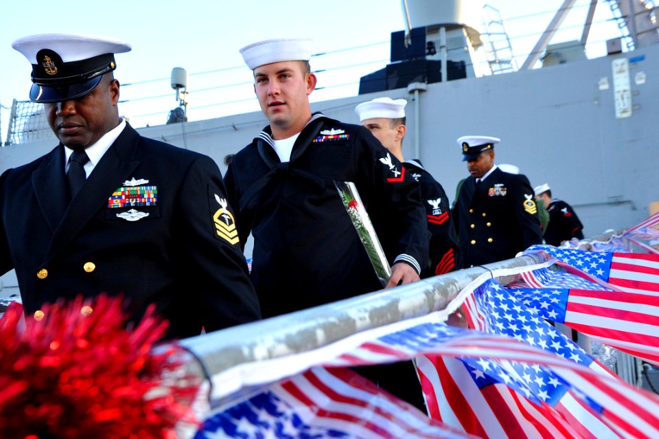 US Navy 111214-N-AW702-007 Sailors aboard the USS Samuel B. Roberts walk down the brow
