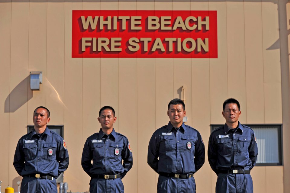 US Navy 121003-N-7441H-003 Firefighters stand outside the new White Beach Fire Station