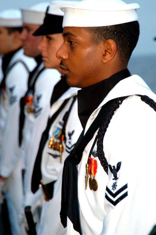 US Navy 040620-N-9446C-016 Ceremonial Guard Members assigned to the Nimitz-class aircraft carrier USS Carl Vinson (CVN 70) stand at attention during a burial at sea ceremony