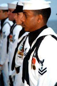 US Navy 040620-N-9446C-016 Ceremonial Guard Members assigned to the Nimitz-class aircraft carrier USS Carl Vinson (CVN 70) stand at attention during a burial at sea ceremony