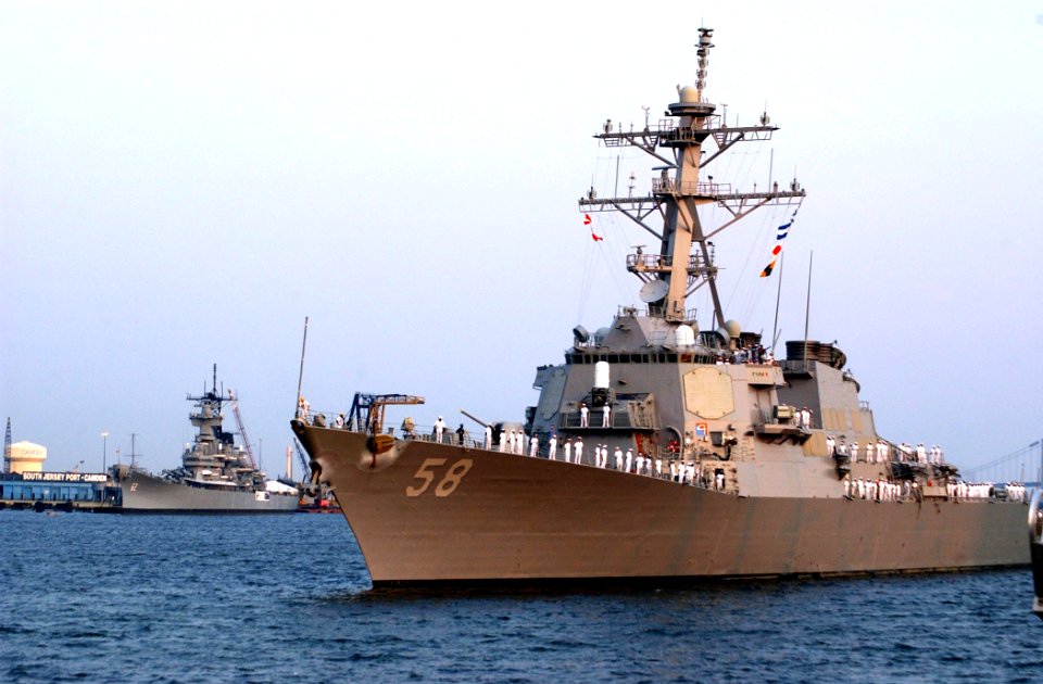 US Navy 040630-N-4729H-012 The guided missile destroyer USS Laboon (DDG 58) passes the battleship USS New Jersey museum as she pulls into Penn's Landing pier in Philadelphia, Pa. on the Delaware River