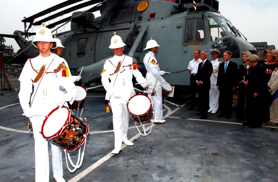 US Navy 040625-N-2568S-011 Secretary of the Navy, Gordon R. England and his wife, accompanied by British Ambassador, Sir David Manning and his wife, look on as the British frigate HMS Cornwall (F 99) crew, performs a traditiona