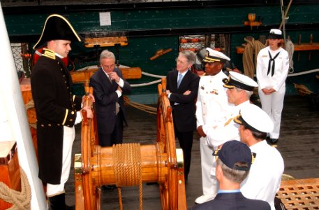 US Navy 040625-N-2568S-002 Secretary of the Navy, Gordon R. England and British Ambassador, Sir David Manning listen as USS Constitution, Executive Officer, Lt. William Marks describes life aboard Constitution in the early 1800