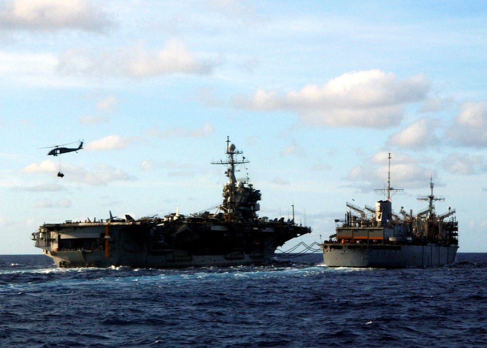 US Navy 040616-N-4374S-001 The aircraft carrier USS John F. Kennedy (CV 67) receives fuel from the fast combat support ship USS Seattle (AOE 3) during an underway replenishment