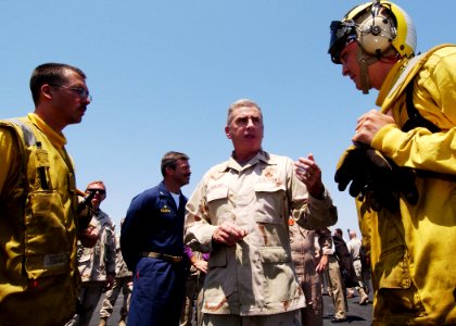 US Navy 040719-N-4374S-007 General John Abizaid Commander, U.S. Central Command, speaks with a Sailor on the flight deck of USS John F. Kennedy (CV 67)