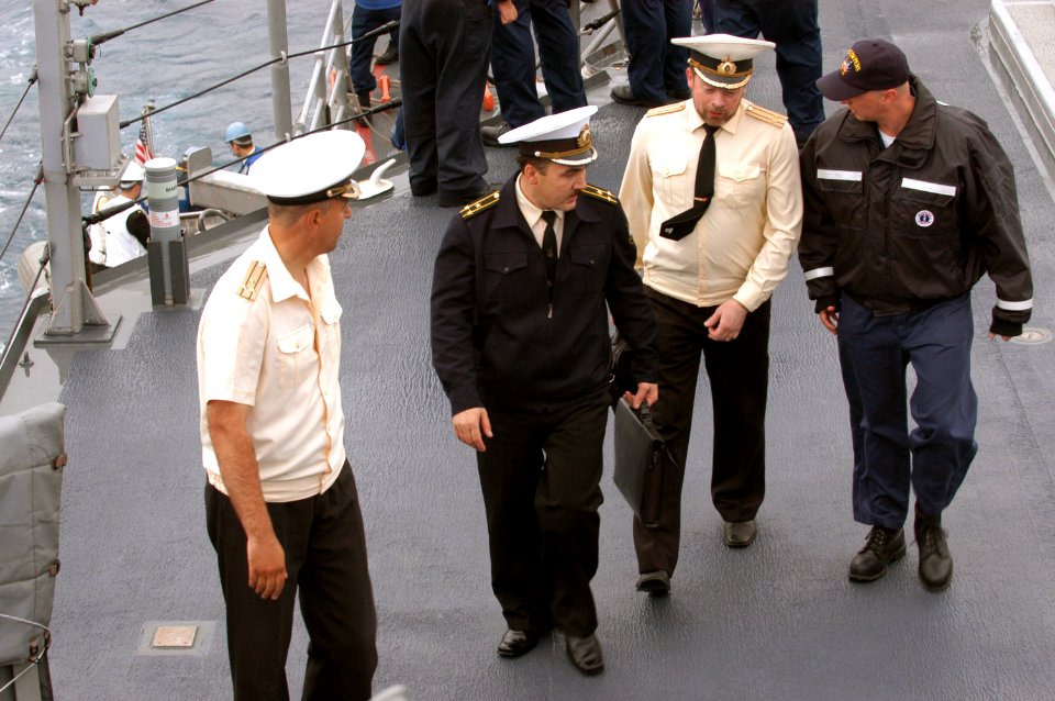 US Navy 040702-N-1194D-003 The ship's Chaplain aboard the guided missile cruiser USS Cowpens (CG 63) Lt. Henry Holcomb, far right, greets Russian Dignitaries