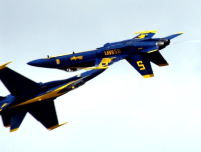 US Navy 040514-N-0295M-051 The lead and opposing solo pilots assigned to the Blue Angels, perform a close scissors-cross maneuver