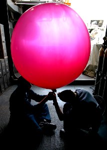 US Navy 040622-N-2972R-080 Aerographer's aboard the amphibious assault ship USS Kearsarge (LHD 3) prepare to deploy a weather balloon