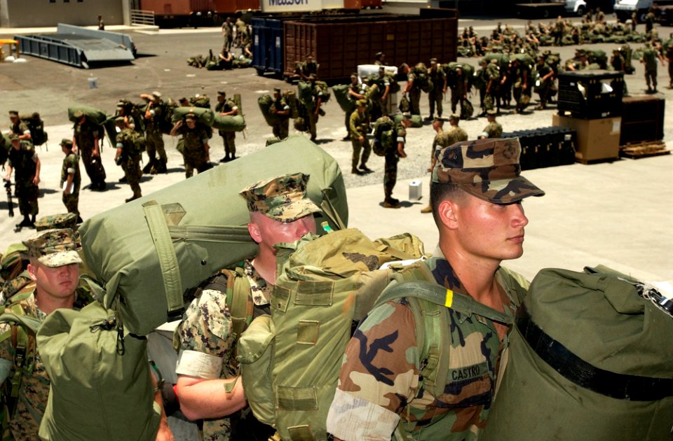 US Navy 040705-N-6811L-156 Marines of the 3rd Battalion, 3rd Marine Regiment board the amphibious assault ship USS Tarawa (LHA 1)
