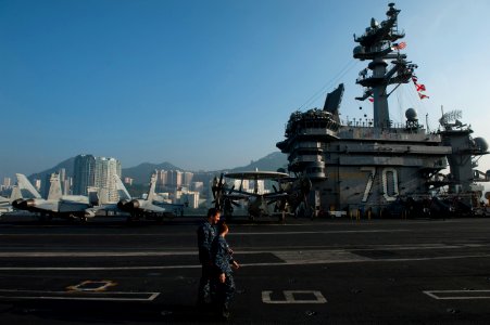 US Navy 111227-N-DR144-097 Sailors transit the flight deck