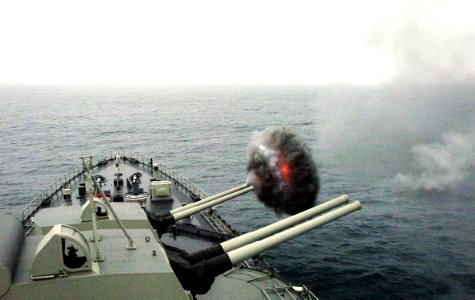 US Navy 040703-N-1464F-001 The Peruvian cruiser Almirante Grau CLM-81 fires one of its 15.2 cm caliber cannons