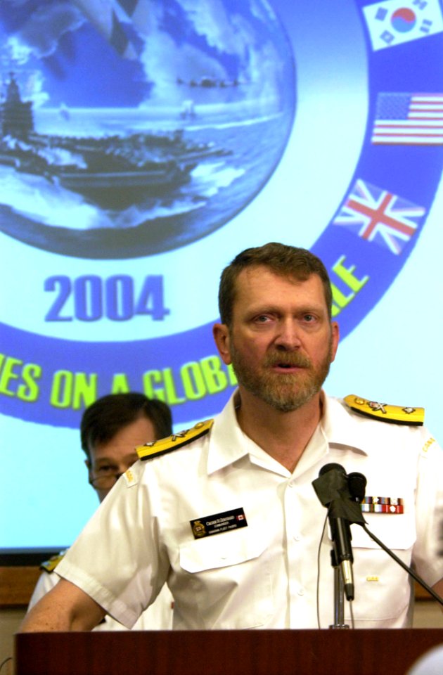 US Navy 040629-N-6811L-035 Commander, Canadian Fleet Pacific, Commodore Roger Girouard, responds to media queries
