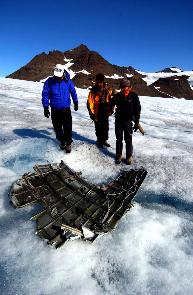 US Navy 040807-N-0331L-006 Recovery personnel examine the wreckage of a Navy P-2V Neptune aircraft that crashed over Greenland in 1962