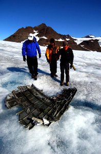 US Navy 040807-N-0331L-006 Recovery personnel examine the wreckage of a Navy P-2V Neptune aircraft that crashed over Greenland in 1962