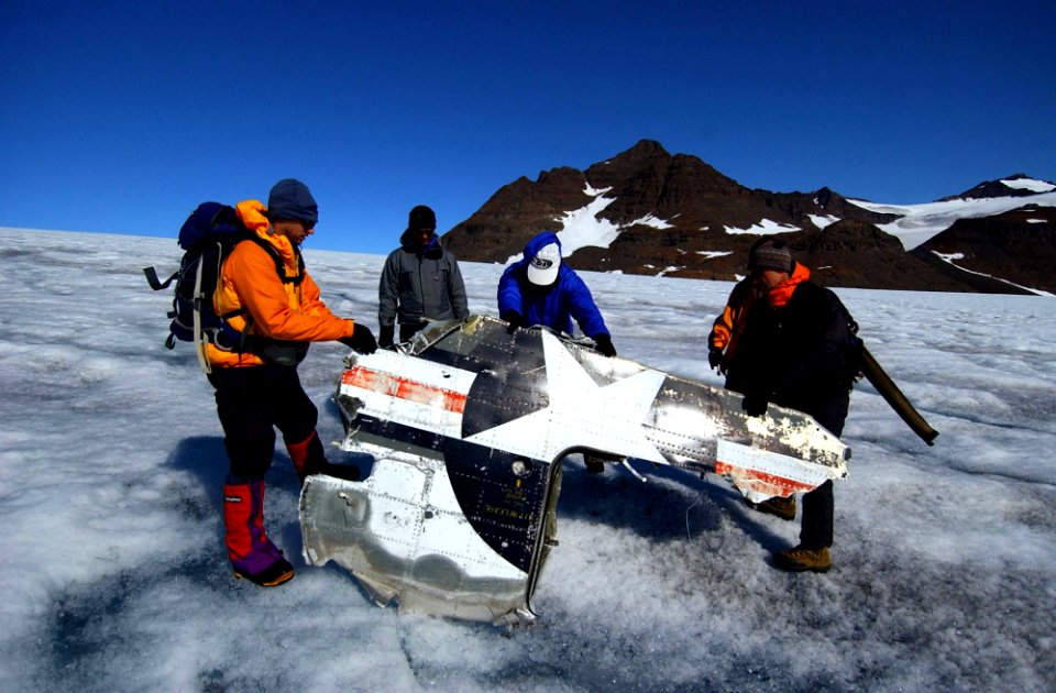 US Navy 040809-N-0331L-001 Recovery personnel examine the wreckage of a Navy P-2-V Neptune aircraft that crashed over Greenland in 1962