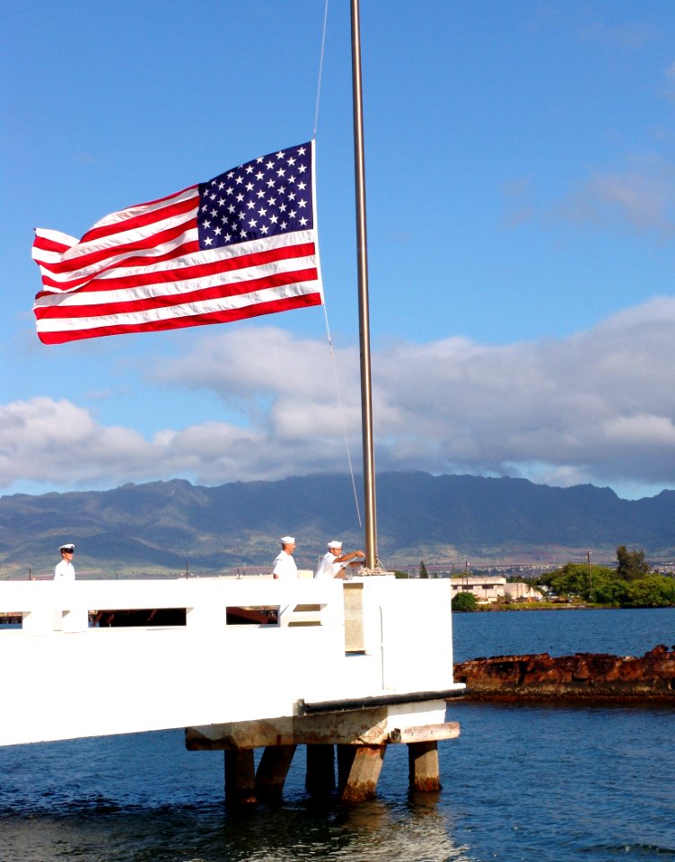 US Navy 040531-N-9643K-008 Sailors assigned to ships based at Pearl Harbor bring the flag to half-mast over the USS Utah Memorial on Ford Island in honor of Memorial Day