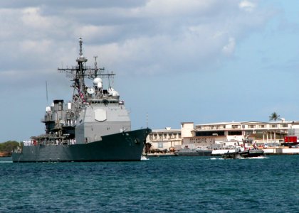 US Navy 040629-N-3581D-009 Sailors aboard the guided missile cruiser USS Lake Champlain (CG 57) man the rails as the ship pulls into Pearl Harbor