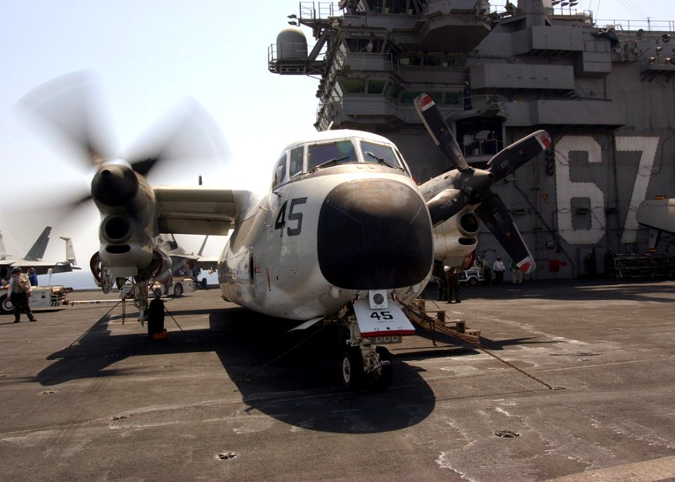 US Navy 040709-N-4374S-014 A C-2 Greyhound assigned to Rawhides of Fleet Logistics Support Squadron Four Zero (VRC-40) performs a start-up procedure on a starboard engine on the flight deck aboard USS John F. Kennedy (CV 67)