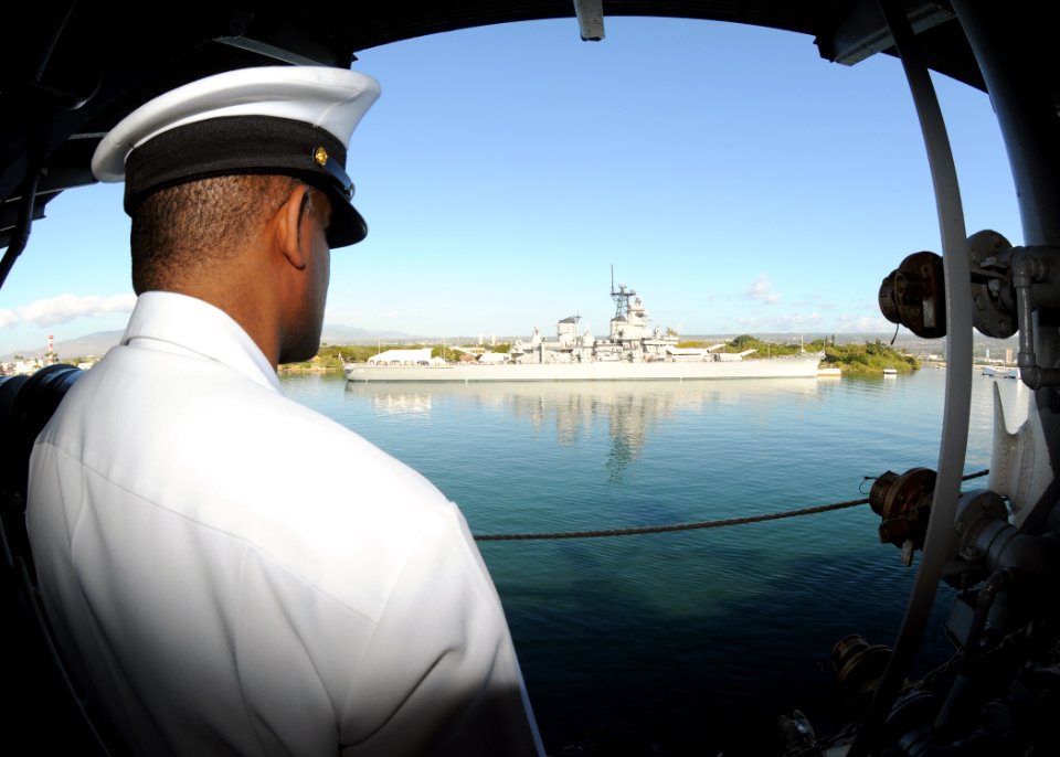 US Navy 120123-N-BK435-099 Chief Yeoman Bernard Green mans the rails as the ship passes the USS Missouri (BB 63) Memorial for a port visit