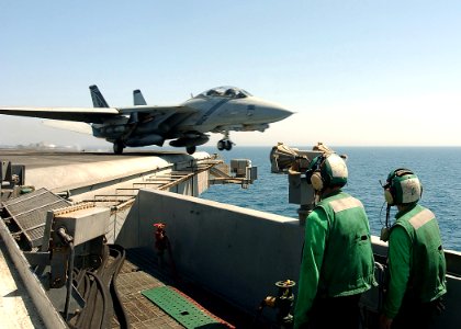 US Navy 040606-N-1045B-010 An F-14B Tomcat assigned to the Pukin' Dogs of Fighter Squadron One Four Three (VF-143) launches from one of four steam powered catapults aboard USS George Washington (CVN 73)