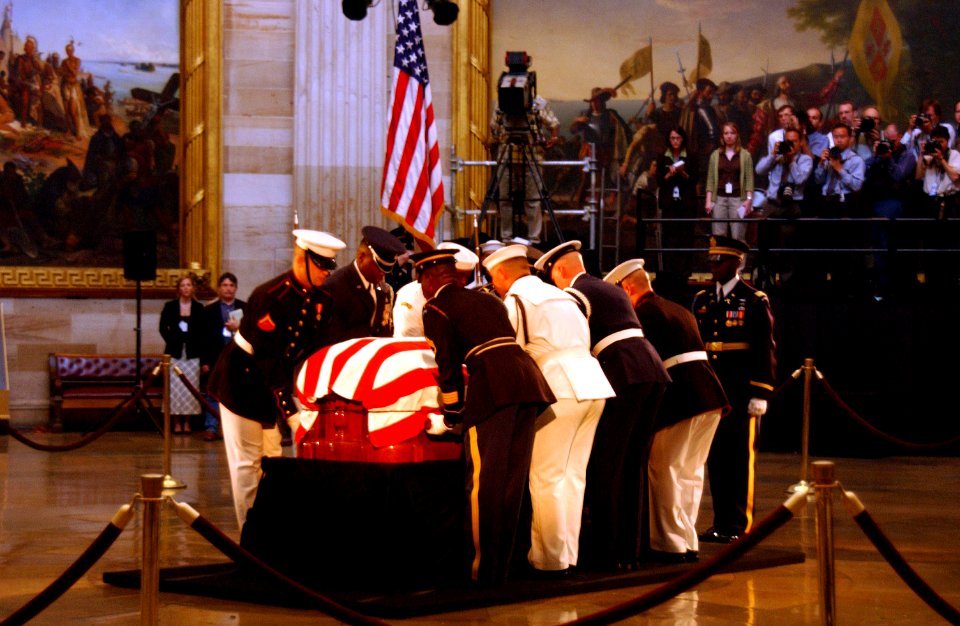 US Navy 040609-A-8024C-010 Ceremonial Honor Guard prepare to move the flag-draped casket of former President Ronald Reagan during his state funeral in the U.S. Capitol Rotunda