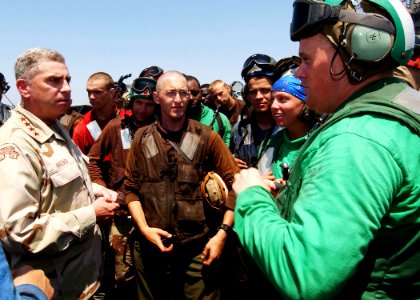 US Navy 040719-N-4374S-008 General John Abizaid Commander, U.S. Central Command, speaks with Sailors on the flight deck of USS John F. Kennedy (CV 67)