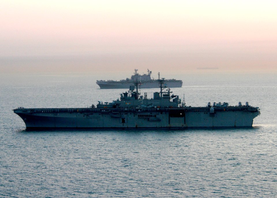 US Navy 040707-N-2972R-036 Sailors and Marines prepare for flight operations aboard the amphibious assault ship USS Kearsarge (LHD 3) to transport elements of the 24th Marine Expeditionary Unit (MEU) to the Kuwait Naval Base