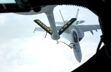 US Navy 040721-F-3488S-005 A Navy F-A-18F Super Hornet assigned to the Black Aces of Strike Fighter Squadron Four One (VFA-41) home based at NAS Lemoore, Calif., is refueled by a KC-135R Stratotanker photo