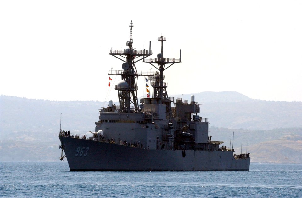 US Navy 040719-N-0780F-047 The destroyer USS Spruance (DD 963) is escorted by tugs as she arrives for a port visit at Souda Bay, Crete, Greece