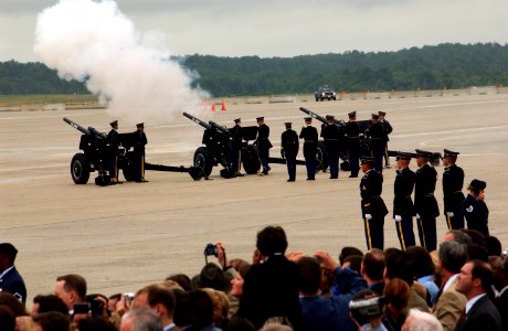 US Navy 040611-A-6042E-071 Ceremonial Honor Guard fire howitzers cannons to render honors on the flight line aboard Andrews Air Force Base for former President Ronald Reagan's departure ceremony