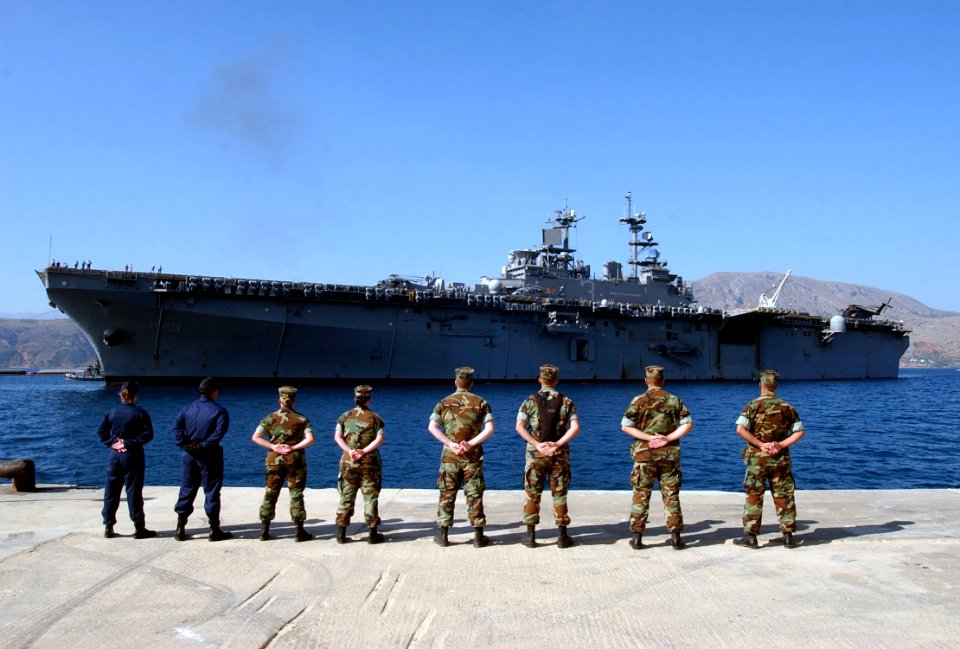 US Navy 040722-N-0780F-042 Volunteer linehandlers from Naval Station Activity (NSA) Souda Bay wait on the pier as the amphibious assault ship USS Kearsarge (LHD 3)