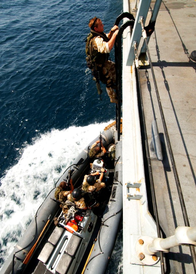 US Navy 040722-N-4374S-014 A British Royal Marine climbs up a ladder to the frigate HMS Somerset (F 82) for a boarding demonstration during a recent visit by Commander, Destroyer Squadron Two Four (COMDESRON 24), Capt. Anthony