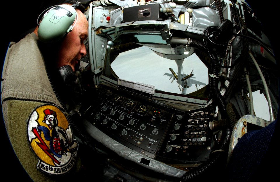 US Navy 040721-F-3488S-016 Master Sergeant Keith Henrys, assigned to the 168th Air Refueling Squadron, Alaska Air National Guard, watches as a Navy F-A-18F Super Hornet assigned to the Black Aces of Strike Fighter Squadron Four