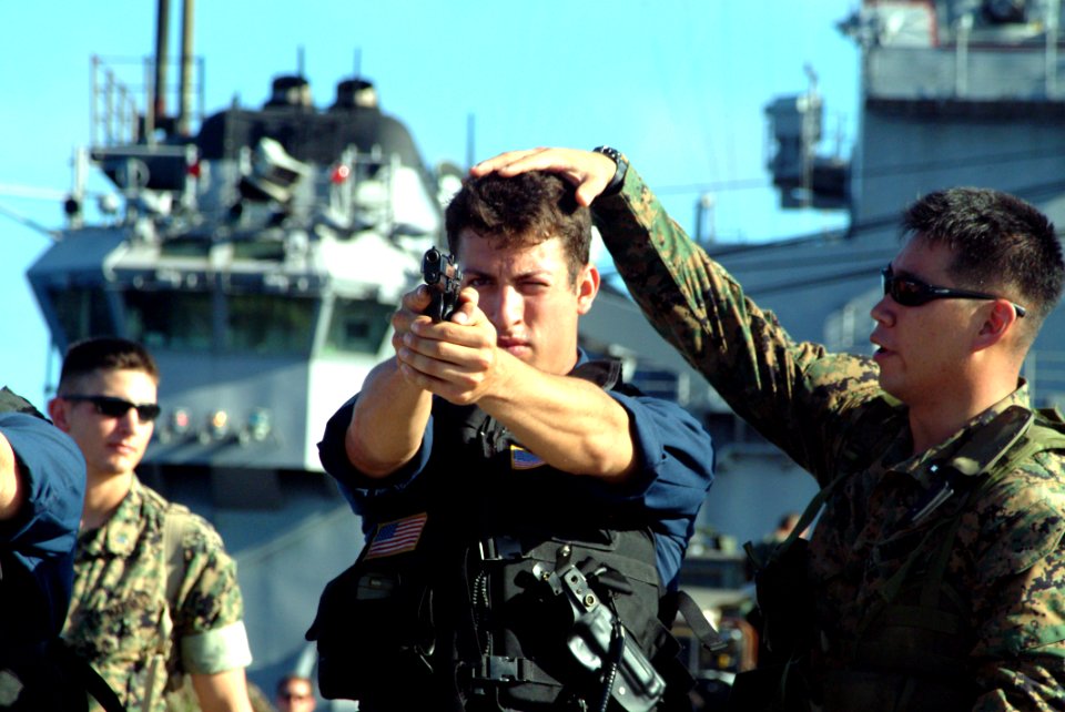 US Navy 040821-N-4772B-002 Gunner's Mate 3rd Class William J. Megenney, from Reynolds, Calif., receives weapons training