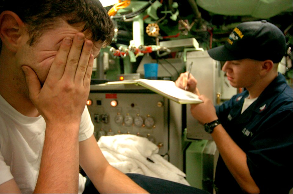 US Navy 040822-N-2653P-357 Machinist's Mate 2nd Class Michael Foster, wipes his face after a long day of Bravo Trials
