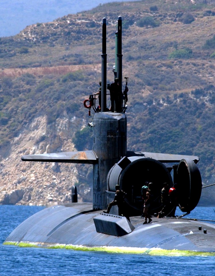 US Navy 040719-N-0780F-070 The Los Angeles-class attack submarine USS Dallas (SSN 700) departs Souda Bay harbor following a brief port visit. Dallas is homported in Groton, Conn., and currently on a routine deployment