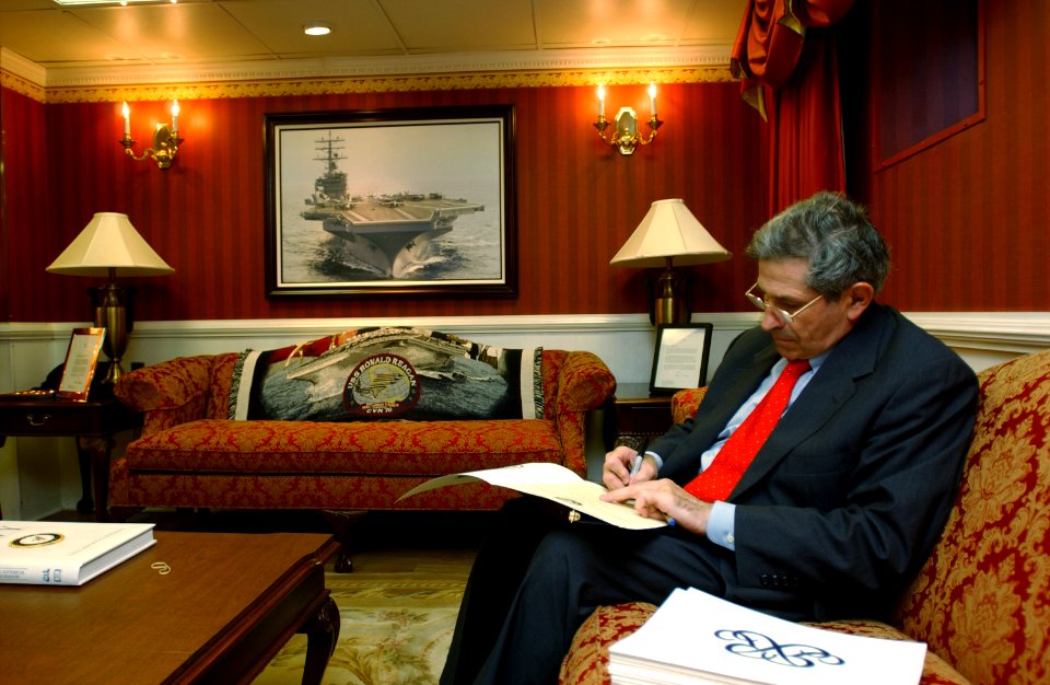 US Navy 040723-F-5586B-001 Deputy Secretary of Defense, Paul D. Wolfowitz, signs a Certificate of Reenlistment in Captain's Cabin aboard USS Ronald Reagan (CVN 76)