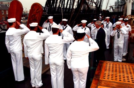 US Navy 040625-N-2568S-005 Secretary of the Navy, Gordon R. England is piped ashore by the honors Boatswain assigned to USS Constitution, following a tour of the ship