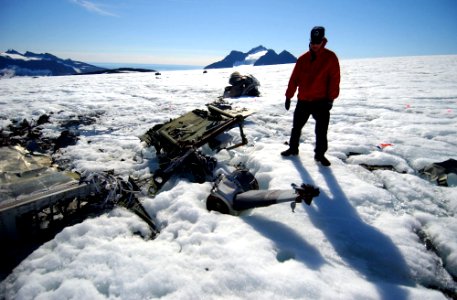 US Navy 040810-N-0331L-003 Chief Aviation Mishap Investigator for the Naval Safety Center, Cdr. Charles Huff, inspects the wreckage of LA-9 a Navy P-2V Neptune aircraft