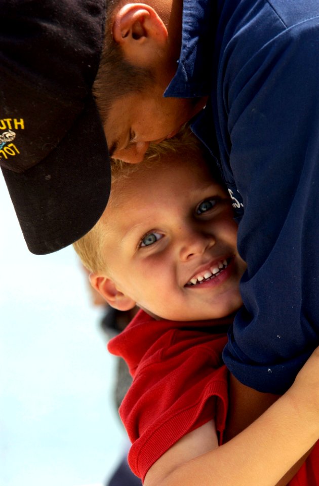 US Navy 040812-N-6811L-077 Machinist's Mate 2nd Class Tom Mitchell, assigned to the Los Angeles class fast attack submarine USS Portsmouth (SSN 707) says goodbye to his son before getting underway