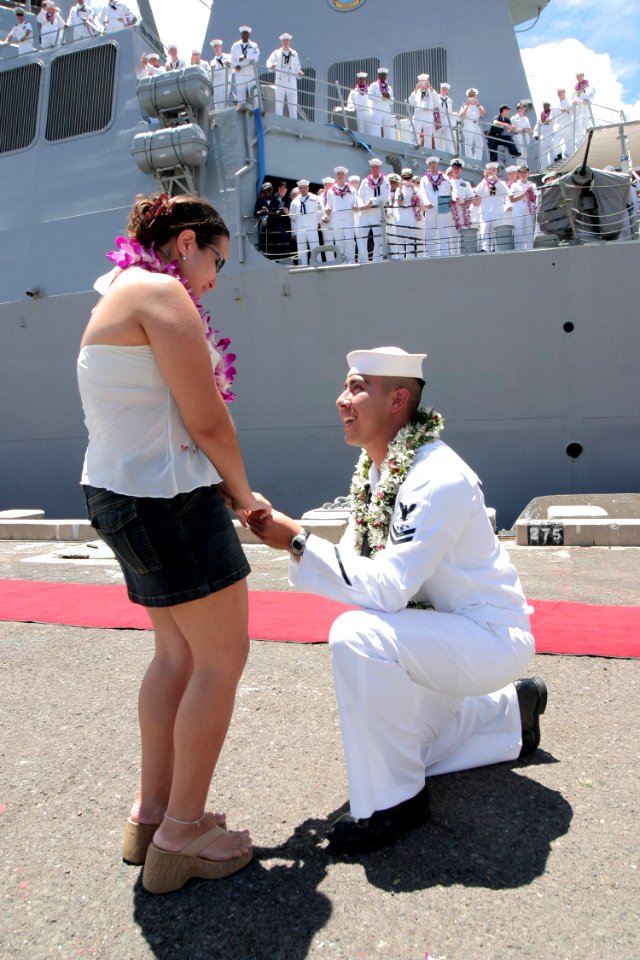 US Navy 040902-N-3228G-010 Sonar Technician 2nd Class Cesar Garcia proposes to his fiancée as his shipmates watch