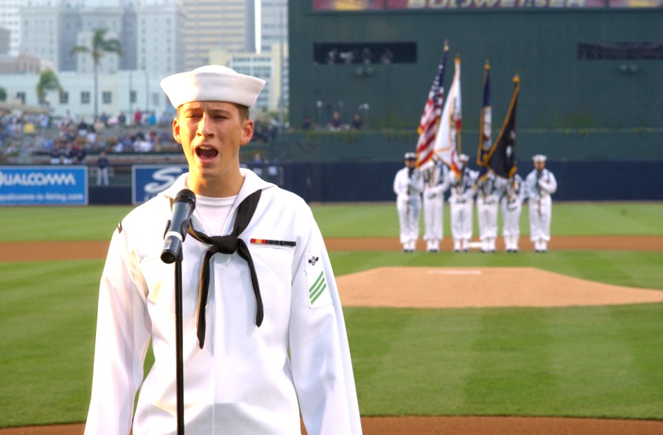 US Navy 040818-N-8295E-123 Airman Philip Welch of Tucson, Ariz., performs the National Anthem prior to the start of the baseball game between the San Diego Padres and the Atlanta Braves