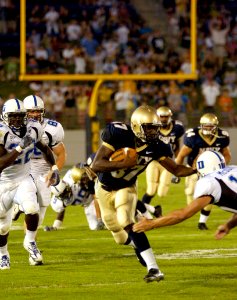 US Navy 040904-N-9693M-006 U.S. Naval Academy Midshipman 1st Class Aaron Polanco runs for a touchdown