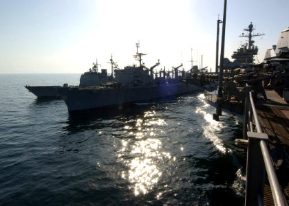 US Navy 040917-N-4374S-001 Fast combat support ship USS Seattle (AOE 3) conducts a replenishment at sea (RAS) with guided missile cruiser USS Vicksburg (CG 69) and aircraft carrier USS John F. Kennedy (CV 67) in the Arabian Gul